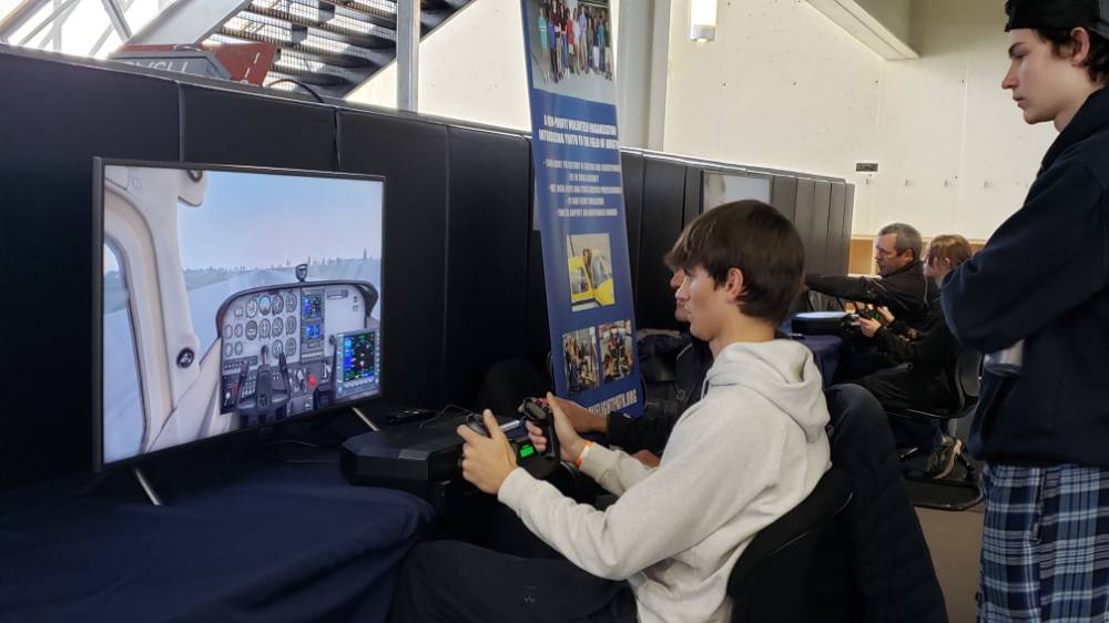 Student at Flight Simulator at Exhibition Hall